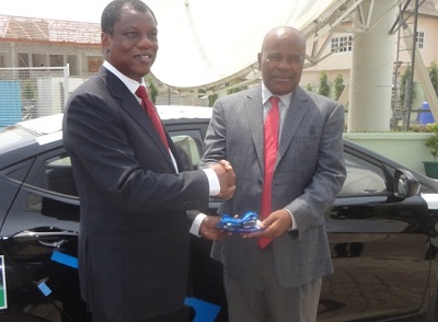 (L-r): Austin Okere, group chief executive officer, Computer Warehouse Group (CWG) handing over the car keys to Professor David Adewumi, NCS President.